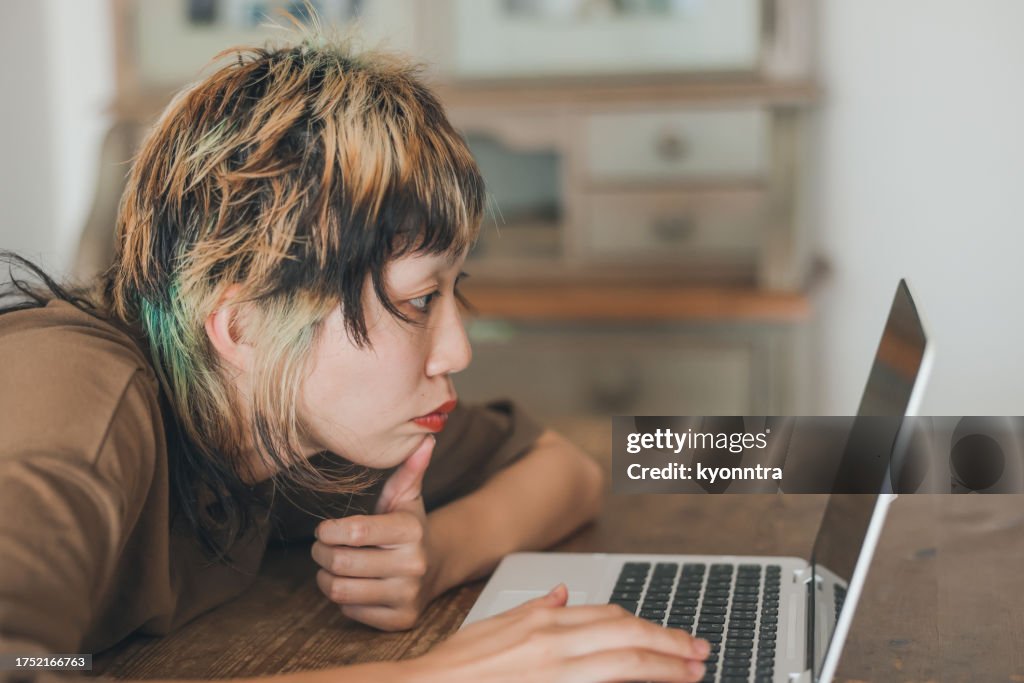Young Gen-Z Female Looking At Screen