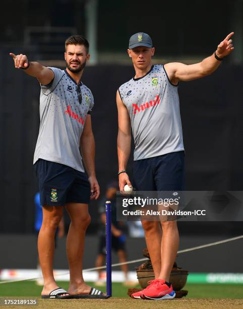 Aiden Markram and Rassie van der Dussen of South Africa interact during the ICC Men's Cricket World Cup India 2023South Africa & Bangladesh Net...