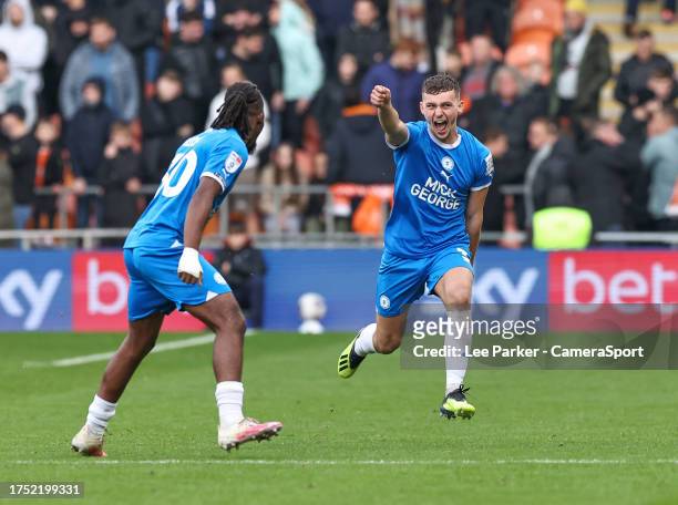 Peterborough United's Harrison Burrows celebrates scoring his side's second goal with Peter Kioso during the Sky Bet League One match between...