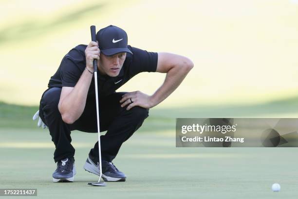 Cam Davis of Australia lines up a putt on the 18th green during the third round of ZOZO Championship at Accordia Golf Narashino Country Club on...