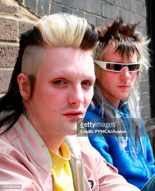 Two Punk boys with a facial hair looking at the camera, Brick Lane, UK 2006.