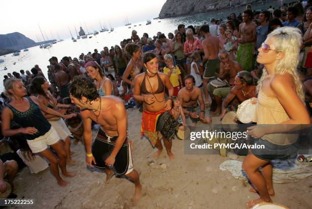 People dancing, Sunset beach party, Benirras Beach, Ibiza, July 2006.