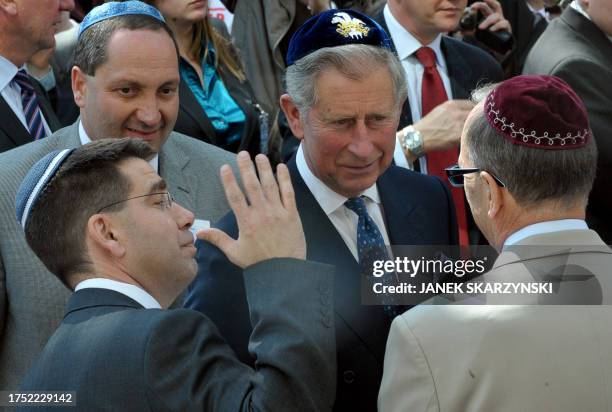 Britain's Prince Charles talks with members of Jewish community during an opening of a new Jewish community center in the heart of Poland's historic...