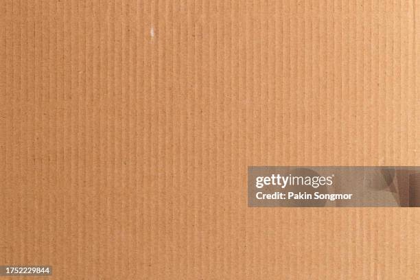 brown color eco recycled kraft paper sheet texture cardboard background. - cartón fotografías e imágenes de stock