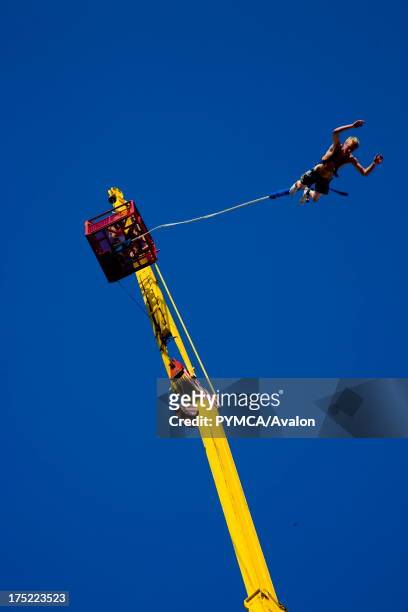 Man doing a bungee jump, Global Gathering festival, Long Marston Airfield, Stoke on Trent, UK. 28/29 July 2006.