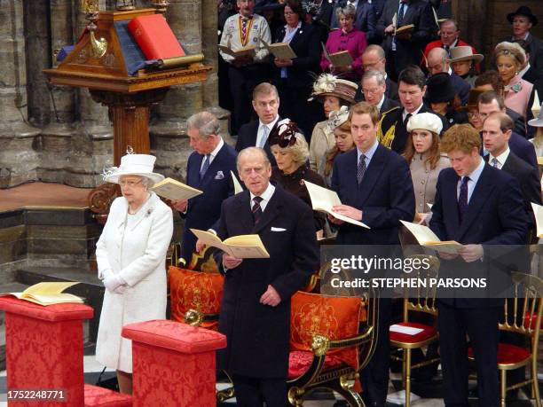 Britain's Queen Elizabeth II and Prince Philip are joined by family members in Westminster Abbey in London, 19 November 2007, during the service of...