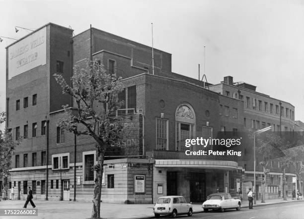 Pedestrians and parked cars outside the Sadler's Wells Theatre, a performing arts venue on Rosebery Avenue in Clerkenwell, London, England, 26th May...