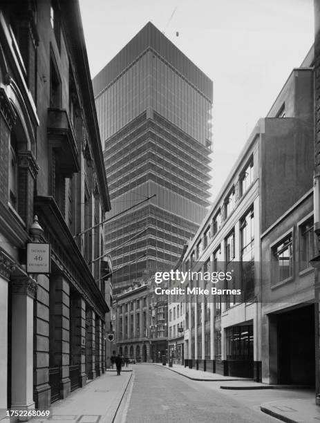 Low-angle view of the Commercial Union building nearing completion on St Mary Axe in the City of London, London, England, 19th April 1968. The...