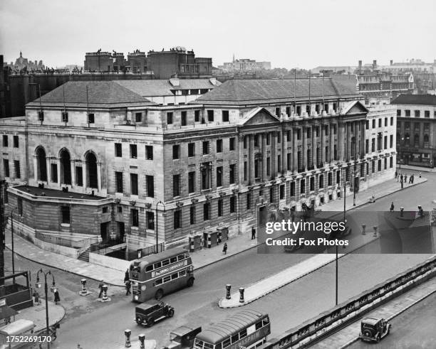 High-angle view of traffic and pedestrians passing St Pancras Town Hall on Euston Road, borough of Camden, London, England, 1945. Later known as...