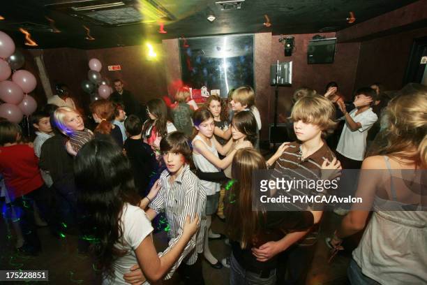 Children dancing 13th birthday party. London 2008.