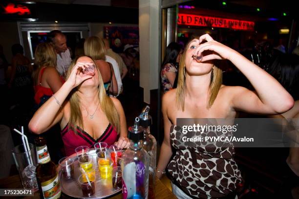 Group of girls drinking. Lineker's Bar, Playa de las Américas. Tenerife, Canary Islands. 2007.