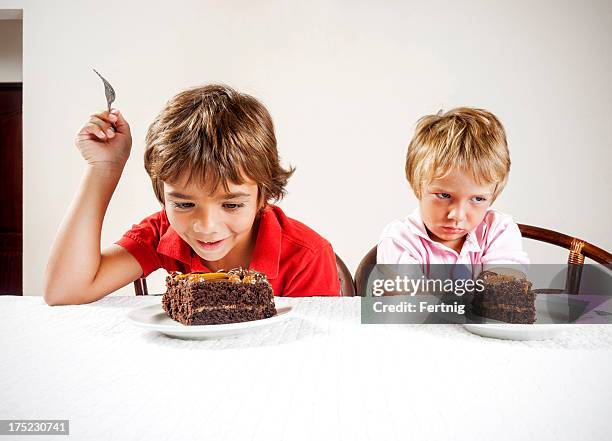 inequality concept, large slice small serving. - little brother stock pictures, royalty-free photos & images