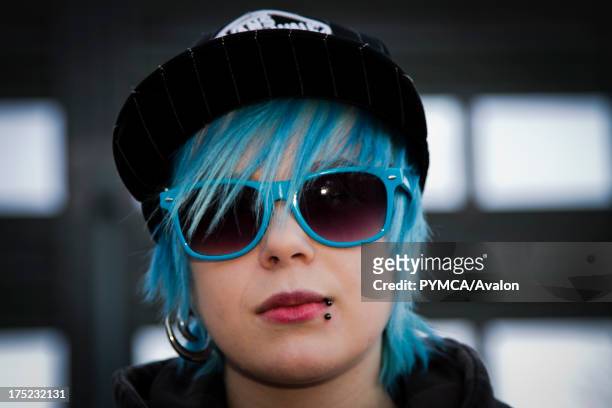Emo girl with blue hair and matching shades, Helsinki, Finland 2010.