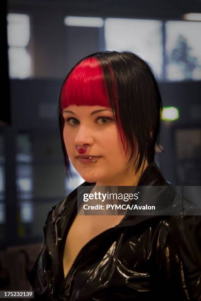 Girl with red hair and piercings. Helsinki, Finland 2010.