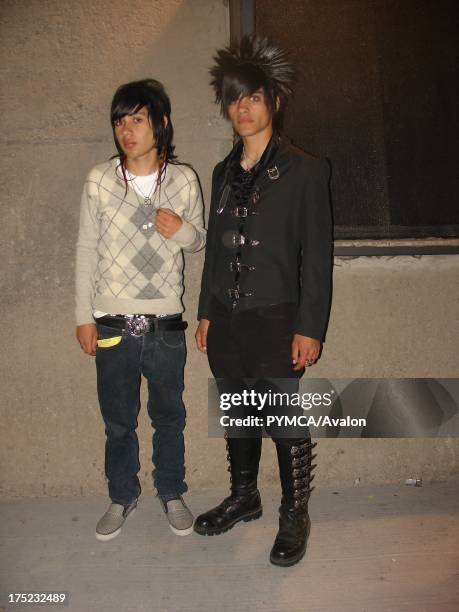 Two Emo boys on with buckle fastenings on boots and jacket on the street, Santiago, Chile 2007.
