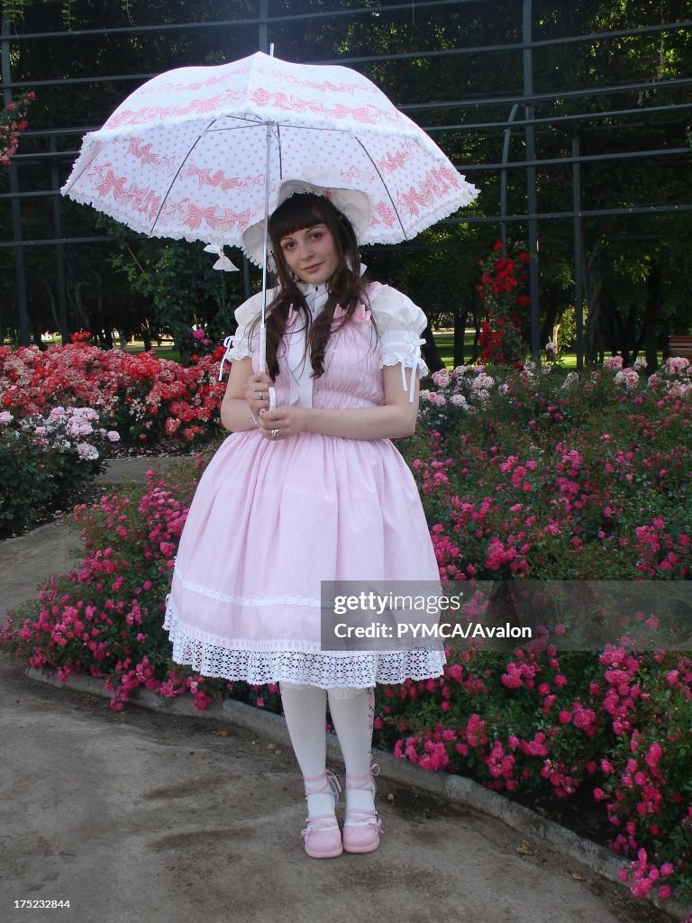 A Lolita girl dressed like Little Bo Peep and carrying an open parasol, Santiago, Chile, 2009.