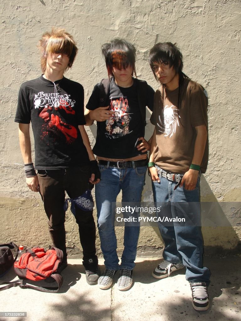3 Emo boys in band t shirts and jeans, Santiago, Chile 2007