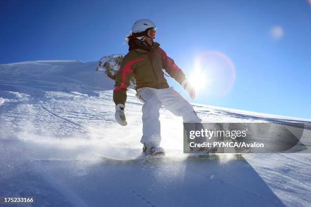 Off-piste snowboarder enjoys the fresh powder snow that has fallen in the backcountry, Tignes, FRANCE. .