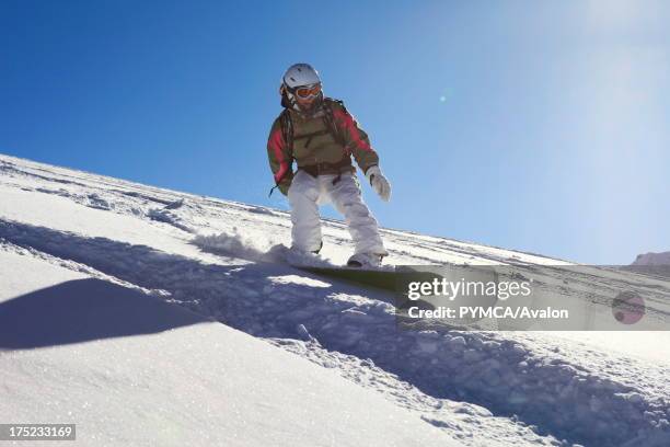 Off-piste snowboarder enjoys the fresh powder snow that has fallen in the backcountry, Tignes, FRANCE. .