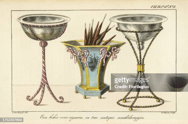 Hexagonal cigar case decorated with ribbons, and two antique bedside lamps. Handcoloured copperplate engraving by D. Sluyter after an illustration by...