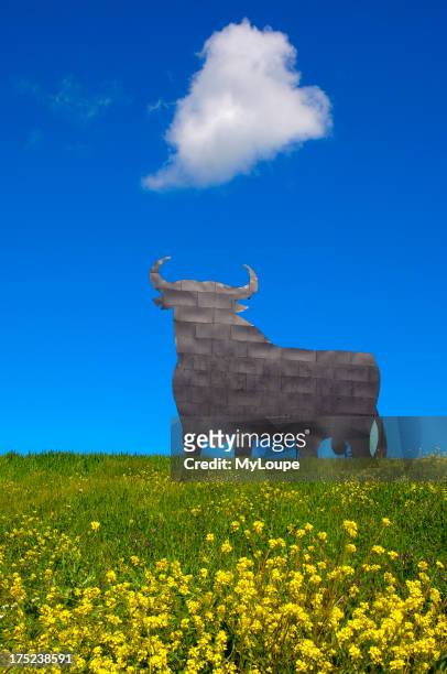 Bull silhouette, typical advertising of Spanish sherry Osborne. Malaga. Andalusia, Spain