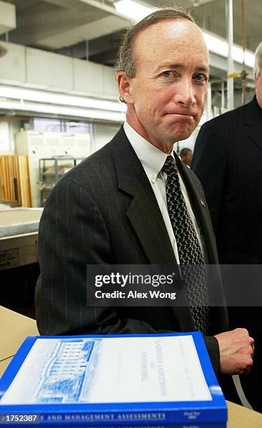 White House Budget Director Mitch Daniels answers questions from the media at the Government Printing Office January 29, 2003 in Washington, DC. The...