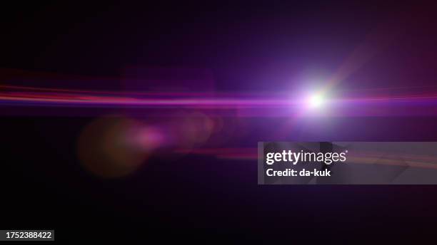 purple futuristic lens flare overlay on black background design element - light flare stock pictures, royalty-free photos & images