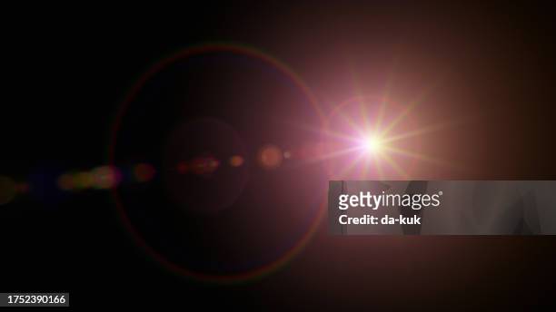 red lens flare overlay on black background design element - lens flare overlay stock pictures, royalty-free photos & images
