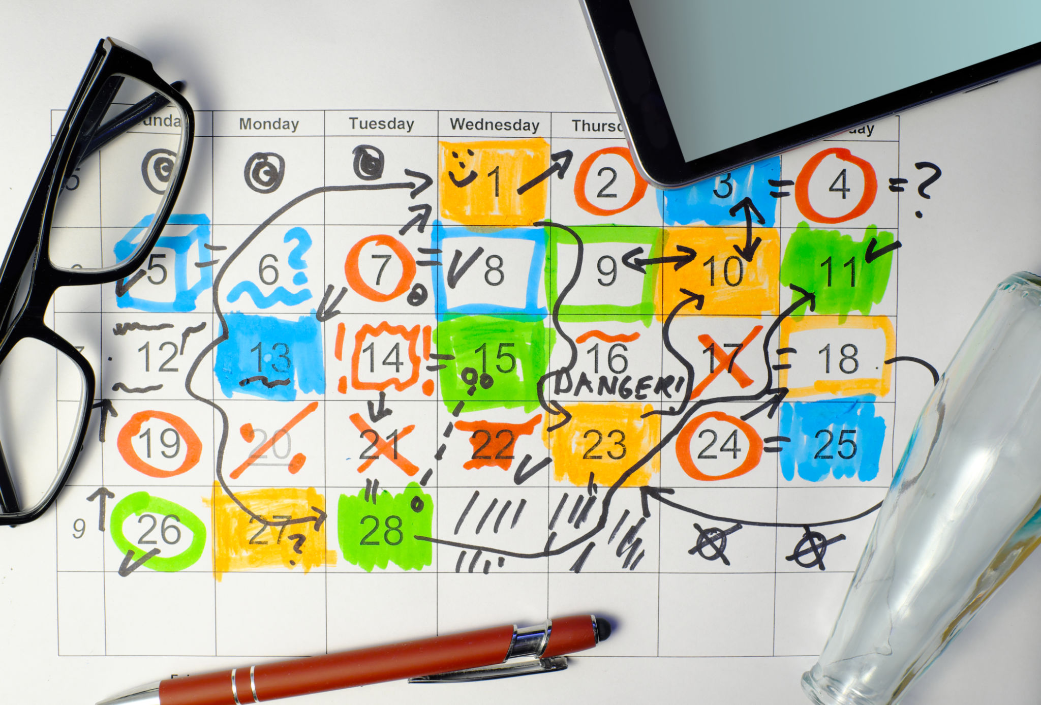 Calendar with business appointments,pens and spectacles, monthly schedule. Business concept,beat the clock. Calendar with business appointments,pens and spectacles, monthly schedule. Business concept,beat the clock.