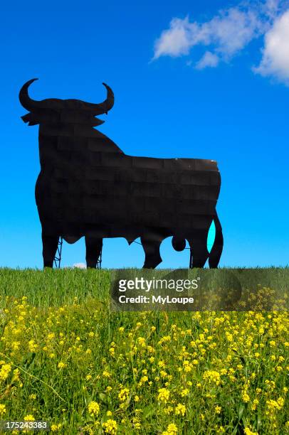 Bull silhouette, typical advertising of Spanish sherry Osborne. Malaga. Andalusia, Spain