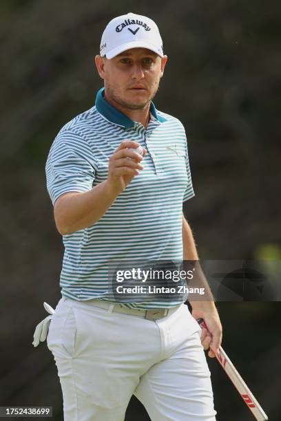 Emiliano Grillo of Argentina acknowledges the gallery on the 9th green during the final round of ZOZO Championship at Accordia Golf Narashino Country...