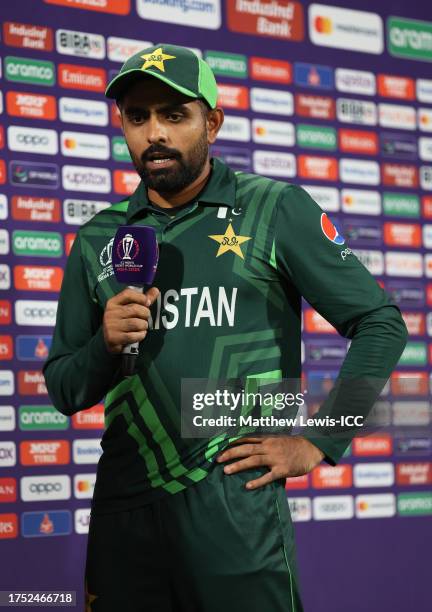 Babar Azam of Pakistan looks on as they are interviewed by Ramiz Raja following the ICC Men's Cricket World Cup India 2023 between Pakistan and...