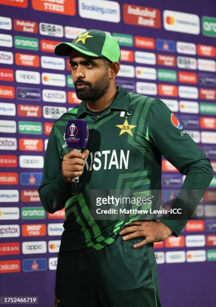 Babar Azam of Pakistan looks on as they are interviewed by Ramiz Raja following the ICC Men's Cricket World Cup India 2023 between Pakistan and...