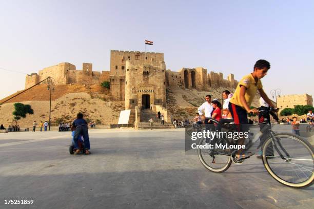 Aleppo Citadel square people bicycle, Syria