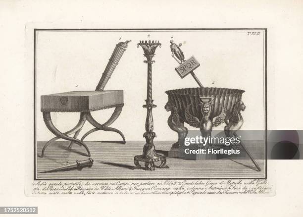 Portable military field stool or qurule 1, Greek metal candelabra from the Galleria di Portici 2, Roman labrum or bath with sphinxes in the Villa...