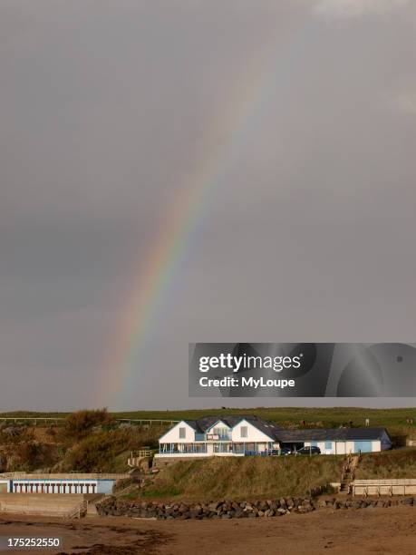 Rainbow over Lifes a beach restaurant, Bude, Cornwall