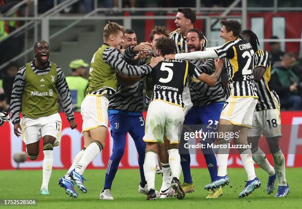 Manuel Locatelli of Juventus FC celebrates with team mates after scoring the team's first goal during the Serie A TIM match between AC Milan and...