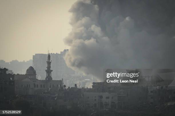 An incoming Israeli military strike on buildings in Gaza City, as seen from the border area on October 23, 2023 near Sderot Israel. As Israel...