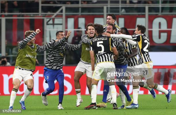 Manuel Locatelli of Juventus FC celebrates with team mates after scoring the team's first goal during the Serie A TIM match between AC Milan and...