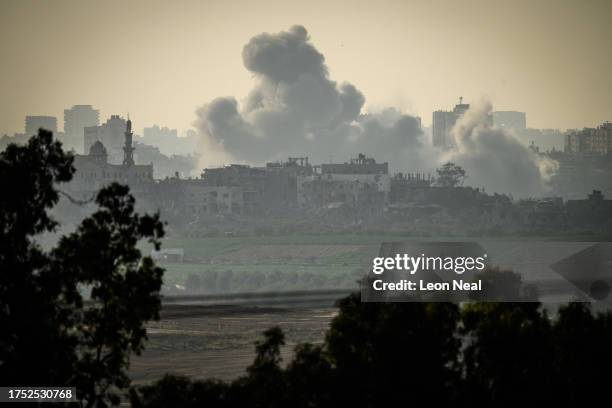 An incoming Israeli military strike on buildings in Gaza City, as seen from the border area on October 23, 2023 near Sderot Israel. As Israel...