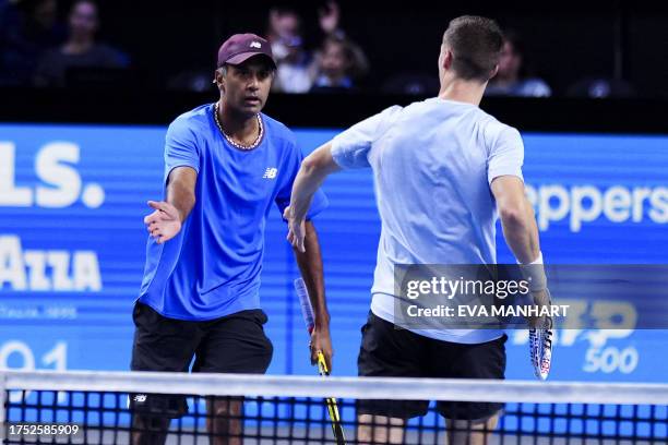 Britain's Joe Salisbury and USA's Rajeev Ram celebrate winning a point as they play against USA's Nathaniel Lammons and Jackson Withrow during the...