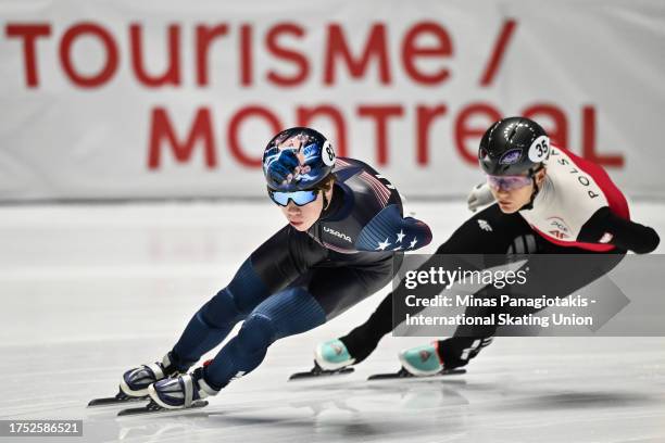 Marcus Howard of the United States of America skates ahead of Lukasz Kuczynski of Poland in the men's 1000 m repechage quarterfinals during the ISU...