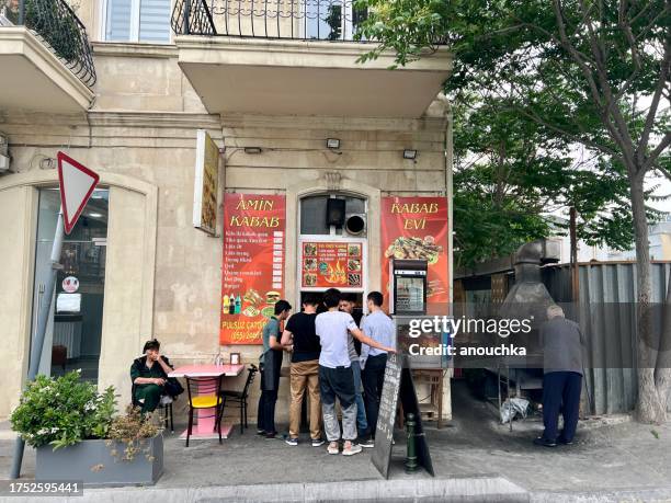 people buying street food on the street, baku, azerbaijan - azerbaijan food stock pictures, royalty-free photos & images