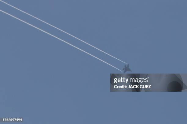 Picture taken from Israel's southern city of Sderot shows an Israeli jet fighter F-35 over the northern Gaza Strip, on October 29 amid ongoing...