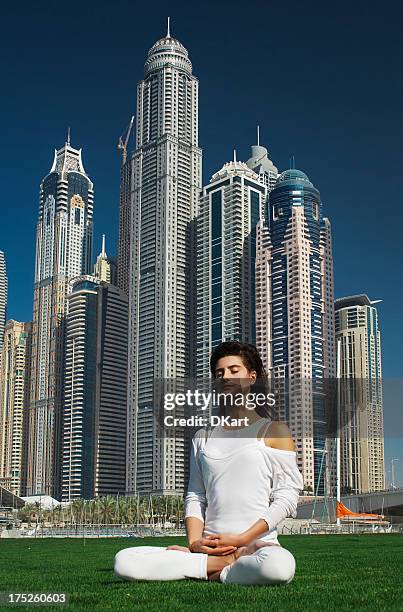 yoga and meditation in a modern urbanistic city - yoga office arab stock pictures, royalty-free photos & images