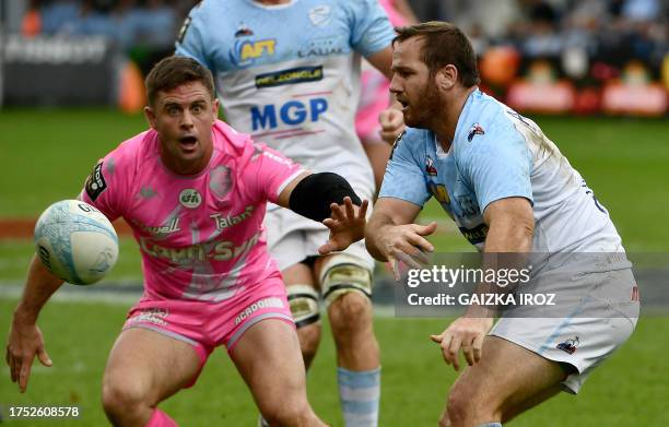 Bayonne's French fly-half and Captain Camille Lopez passes the ball during the French Top14 rugby union match between Aviron Bayonnais and Stade...