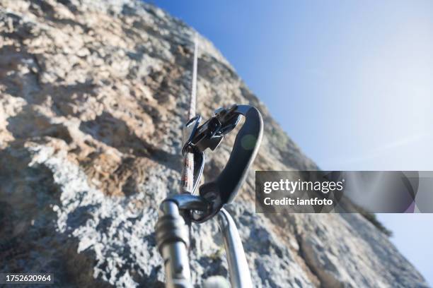 close-up of hand ascender and climbing rope. - ascender stock pictures, royalty-free photos & images