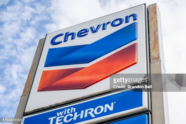 Chevron gas station sign is shown on October 23, 2023 in Austin, Texas. Chevron is acquiring Hess Corp. In a $53 billion deal that will be paid with...