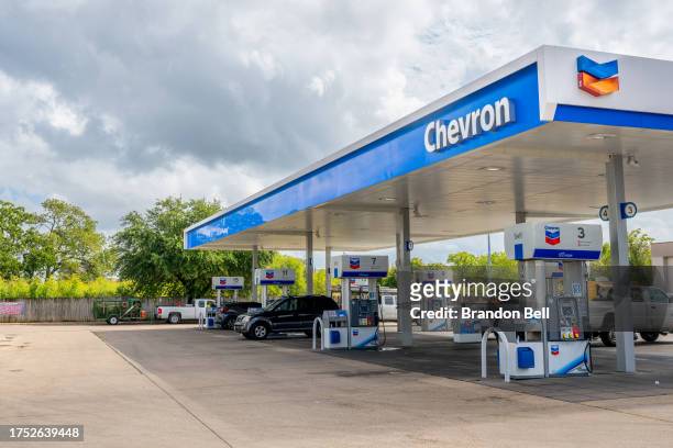Chevron gas station is shown on October 23, 2023 in Austin, Texas. Chevron is acquiring Hess Corp. In a $53 billion deal that will be paid with...