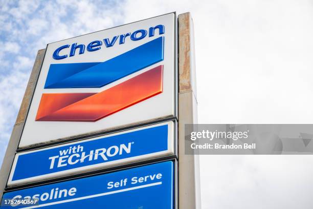 Chevron gas station sign is shown on October 23, 2023 in Austin, Texas. Chevron is acquiring Hess Corp. In a $53 billion deal that will be paid with...